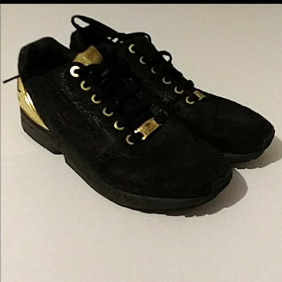 adidas zu flux torsion black and gold shoes